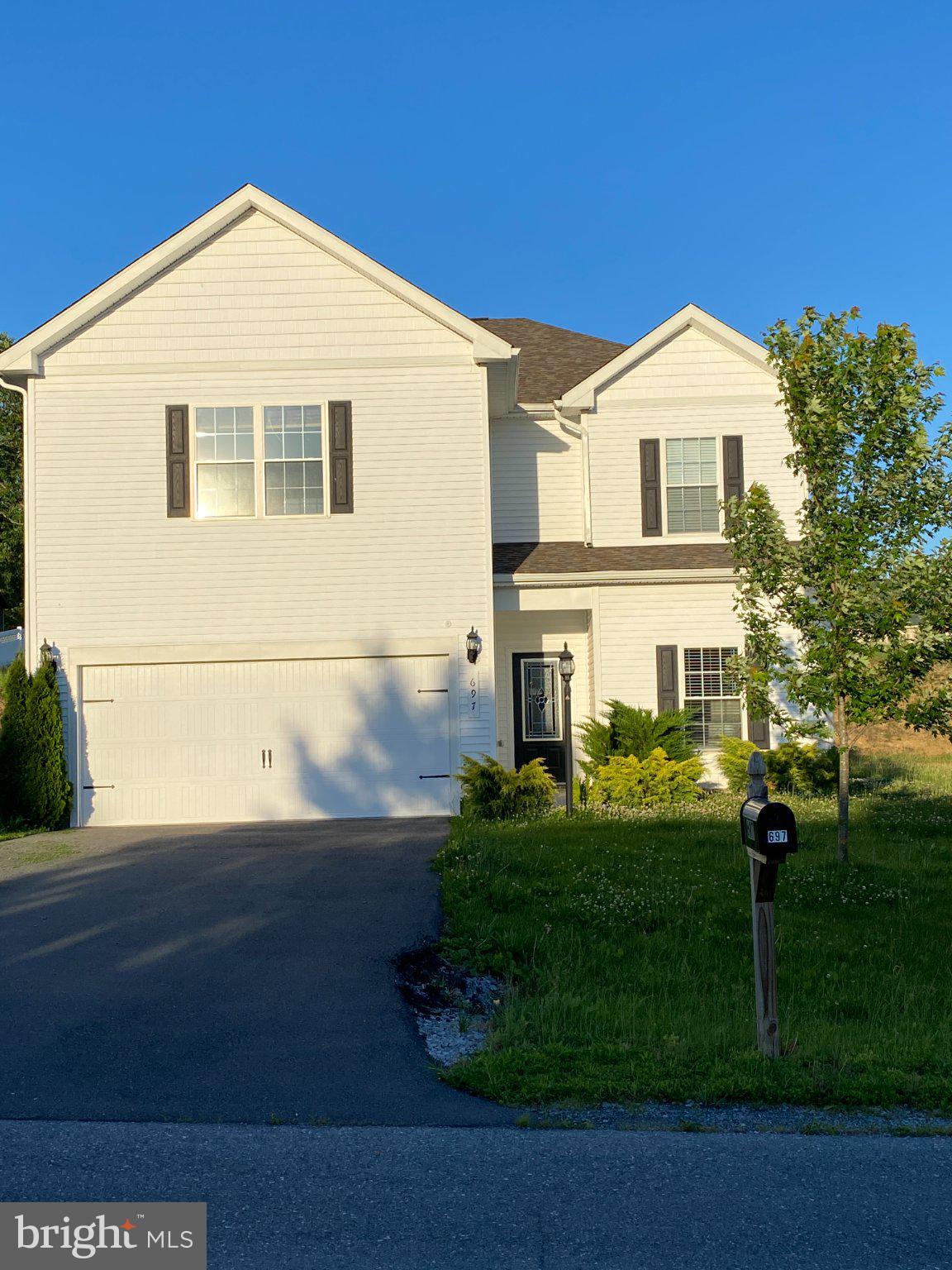 697 Rivanna Run Falling Waters, WV 25419 - Photo 4 of 44 a front view of a house with a yard