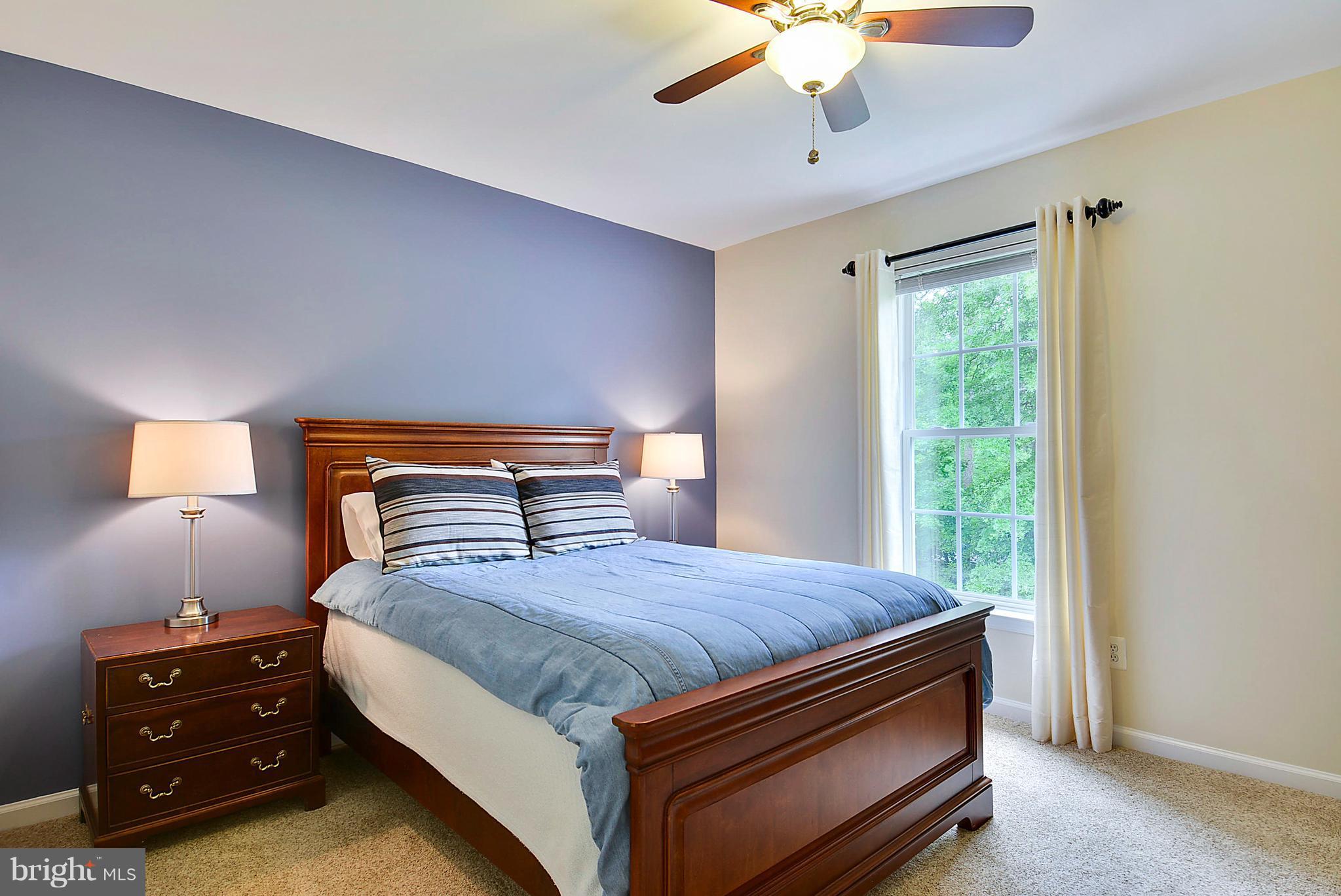 42738 Middle Ridge Place Broadlands, VA 20148 - Photo 22 of 30 a bedroom with a bed and a dresser