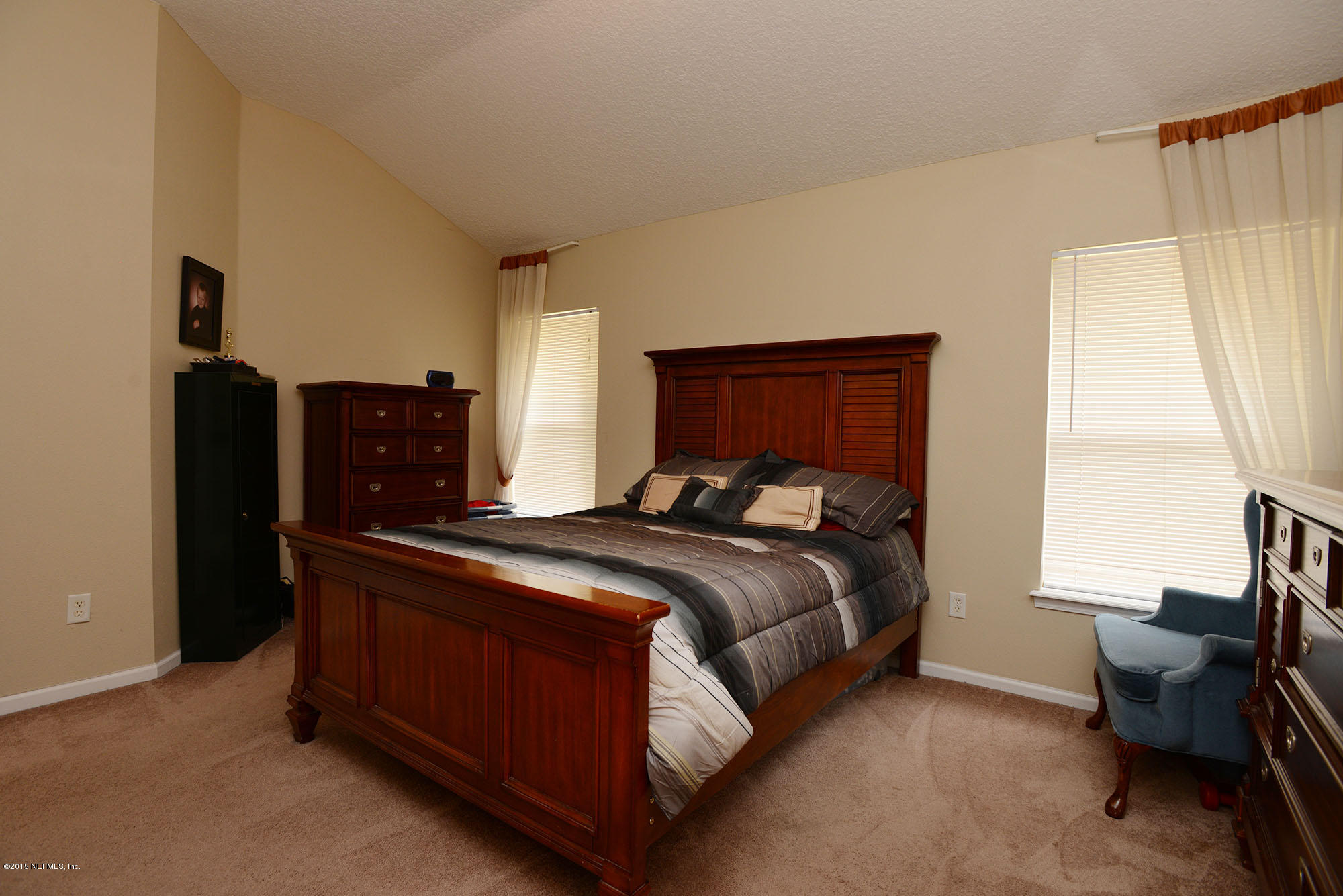 226 Riviera Boulevard St. Augustine Shores, FL 32086 - Photo 13 of 26 a bed sitting in a bedroom next to a window