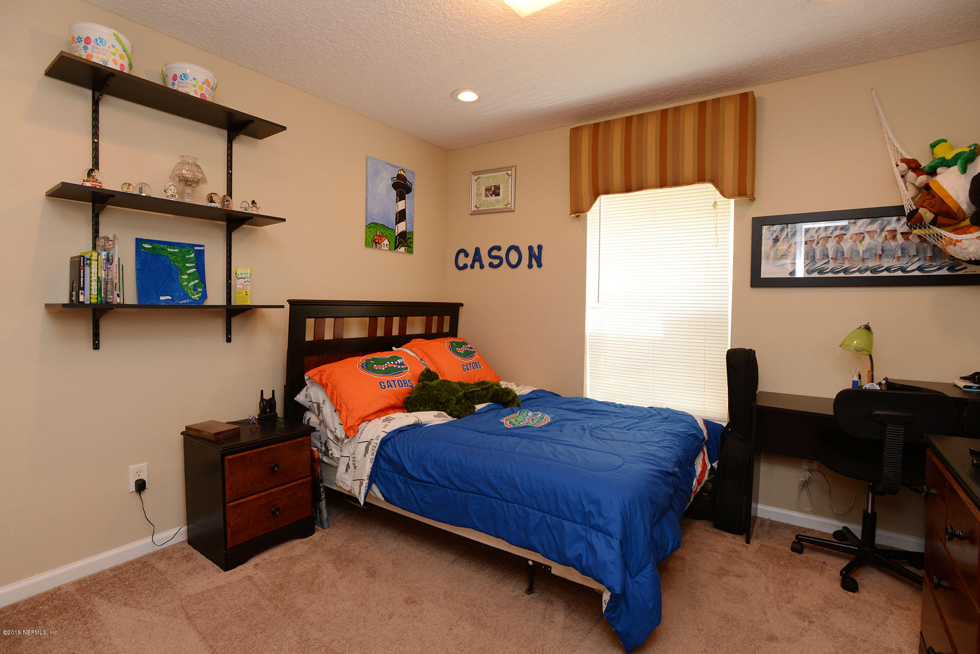 226 Riviera Boulevard St. Augustine Shores, FL 32086 - Photo 16 of 26 a bedroom with a bed and cabinets