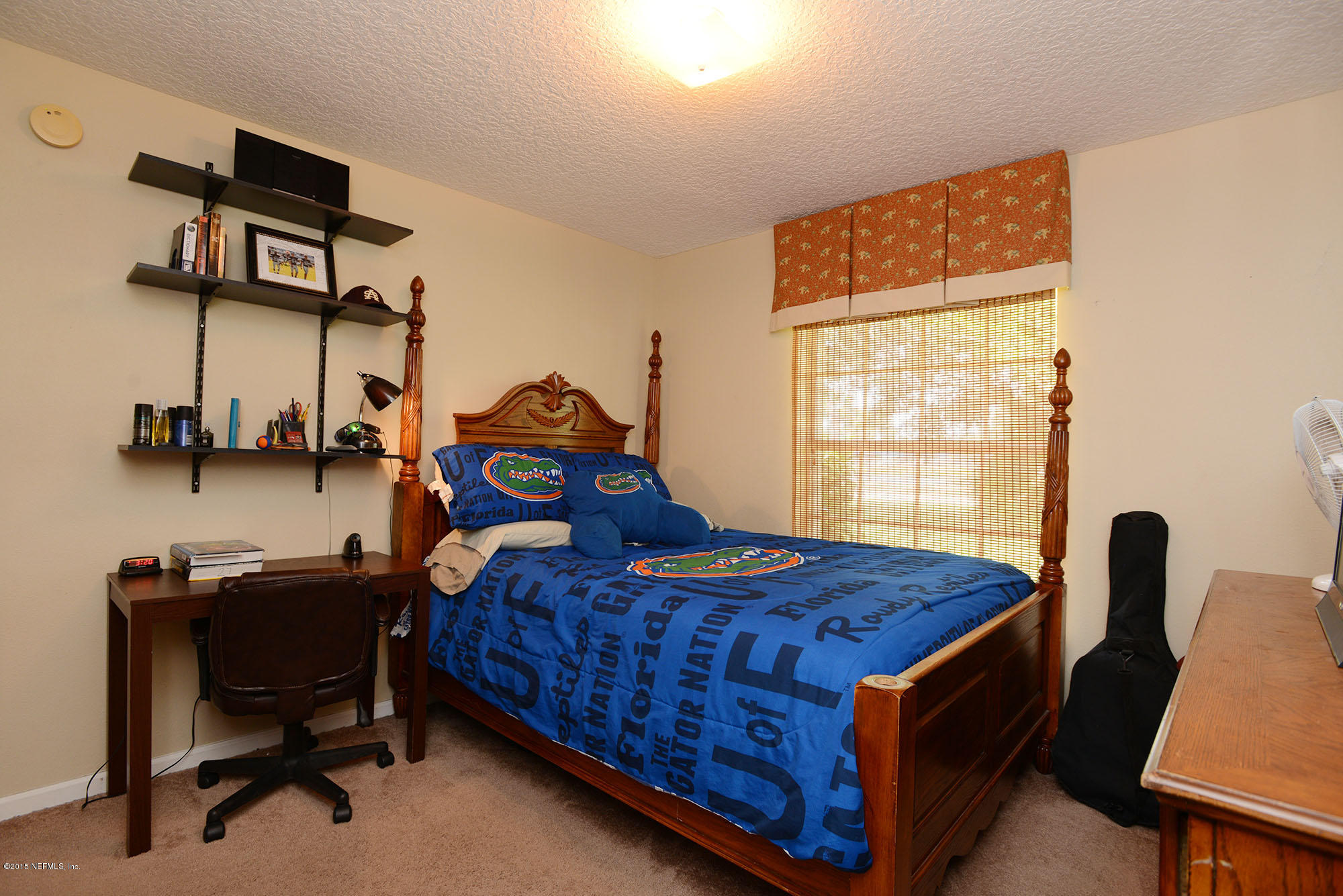 226 Riviera Boulevard St. Augustine Shores, FL 32086 - Photo 17 of 26 a bed room with a bed and a chair
