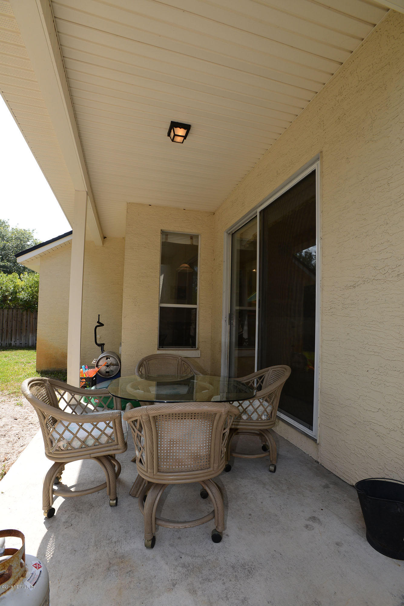 226 Riviera Boulevard St. Augustine Shores, FL 32086 - Photo 22 of 26 a living room with furniture and a table
