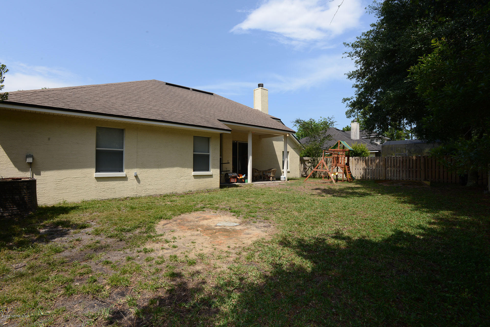 226 Riviera Boulevard St. Augustine Shores, FL 32086 - Photo 24 of 26 a view of a house with backyard and garden