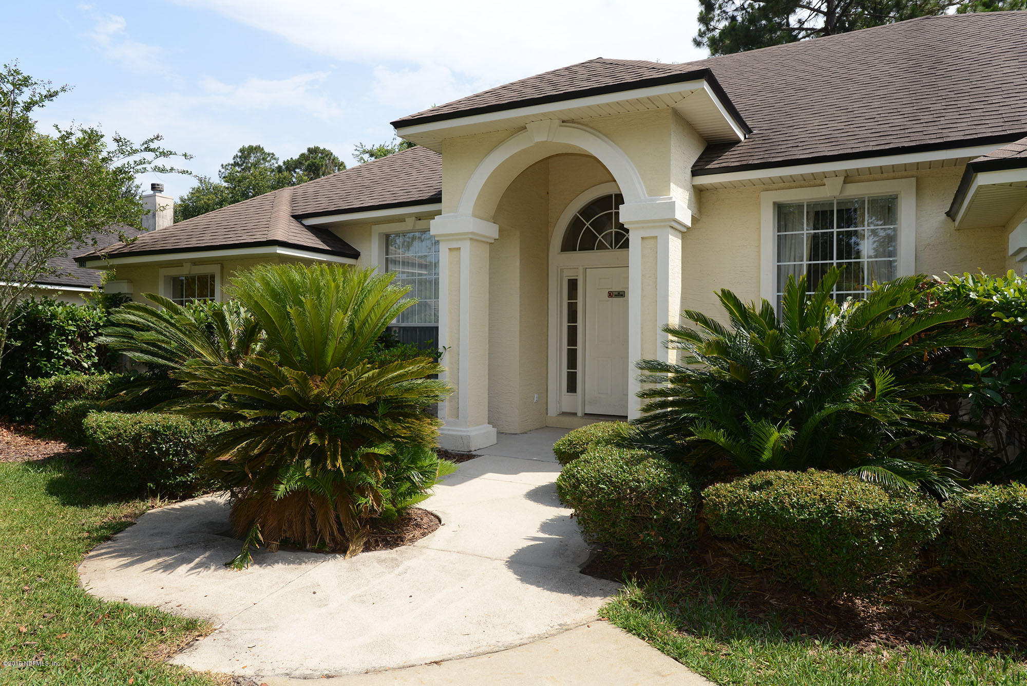 226 Riviera Boulevard St. Augustine Shores, FL 32086 - Photo 3 of 26 a front view of a house with a yard