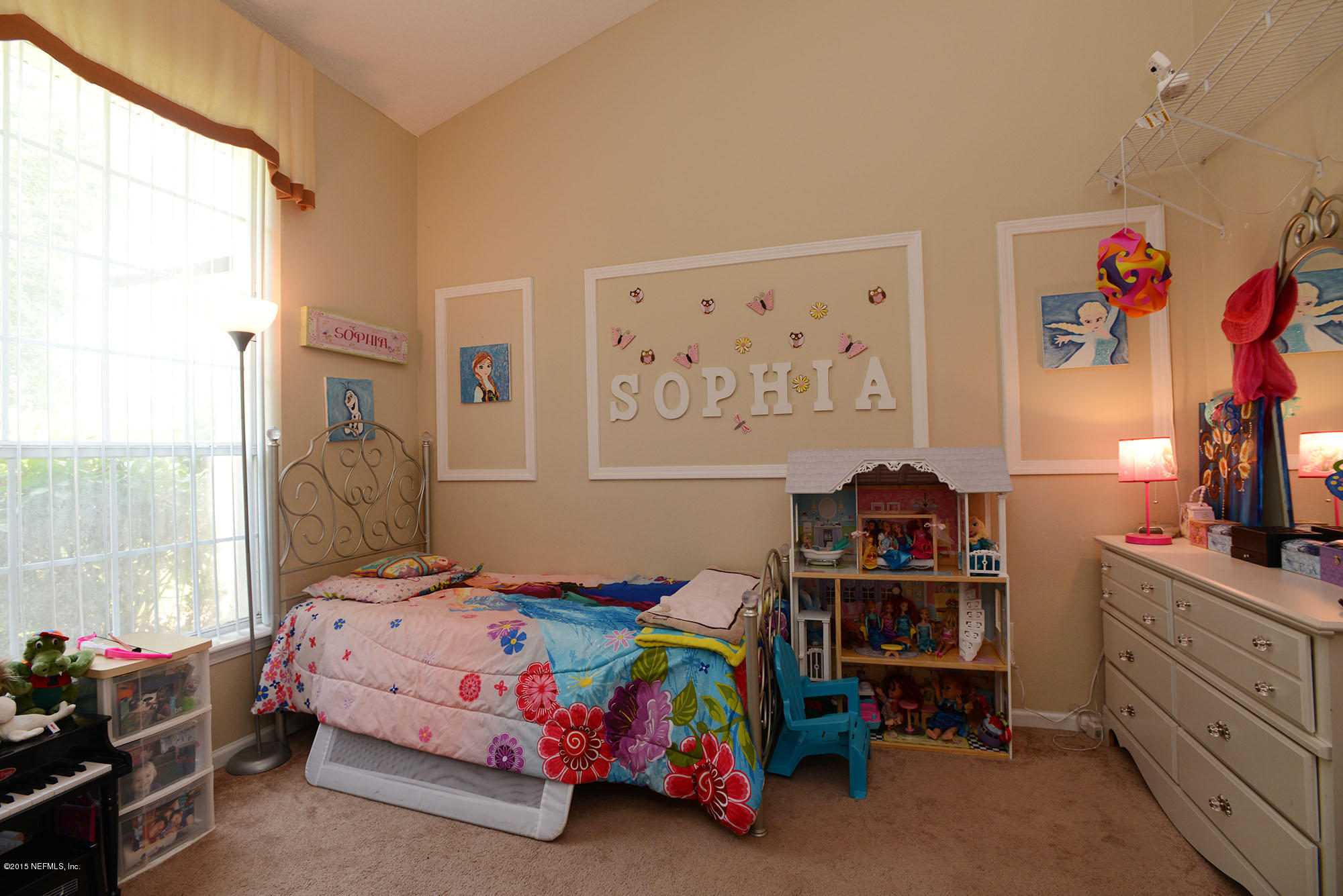 226 Riviera Boulevard St. Augustine Shores, FL 32086 - Photo 5 of 26 a bedroom with a bed and a tv in it
