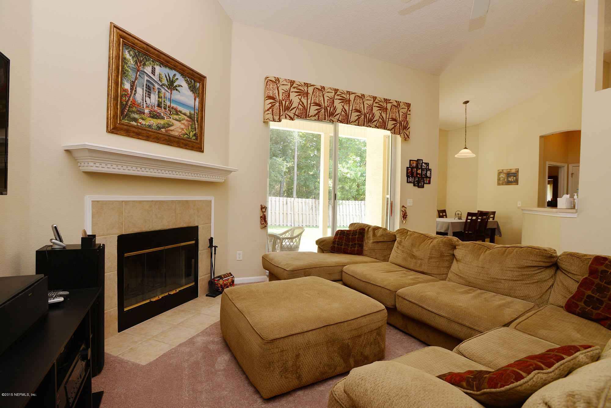 226 Riviera Boulevard St. Augustine Shores, FL 32086 - Photo 7 of 26 a living room with furniture and a fireplace