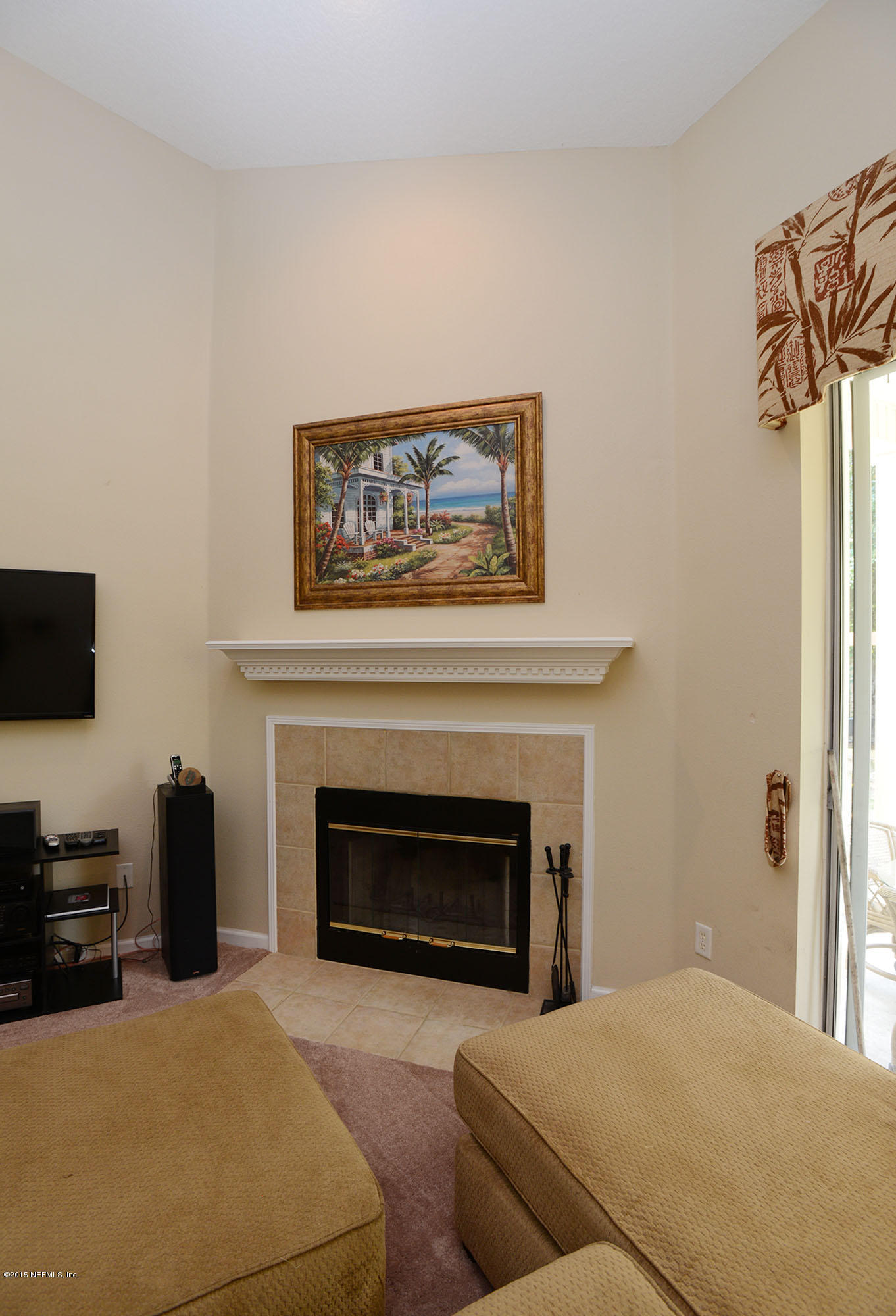 226 Riviera Boulevard St. Augustine Shores, FL 32086 - Photo 8 of 26 a bedroom with a bed and a fireplace