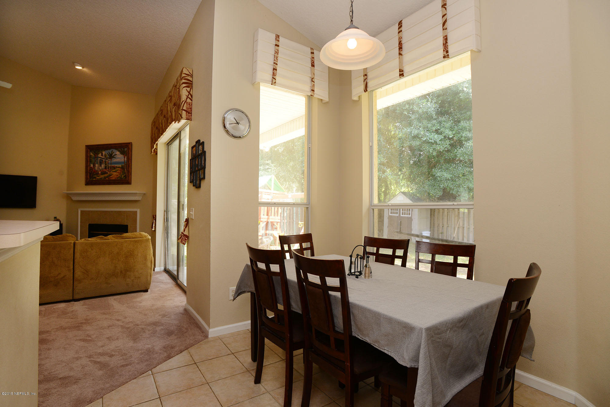 226 Riviera Boulevard St. Augustine Shores, FL 32086 - Photo 9 of 26 a view of a dining room with furniture window and outside view