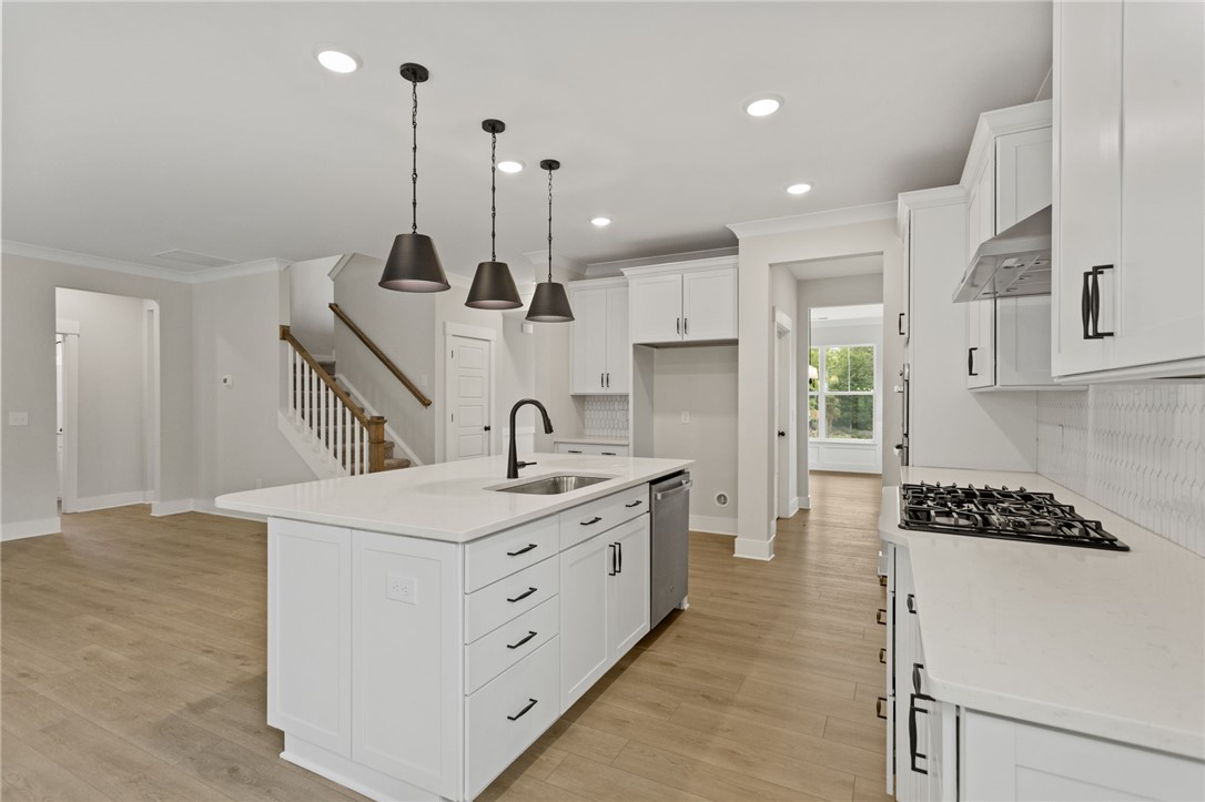313 Old Shirley Road Central, SC 29630 - Photo 6 of 30 This kitchen features a bright, open design with contemporary finishes and a spacious island.