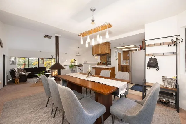 a kitchen with a refrigerator and a sink