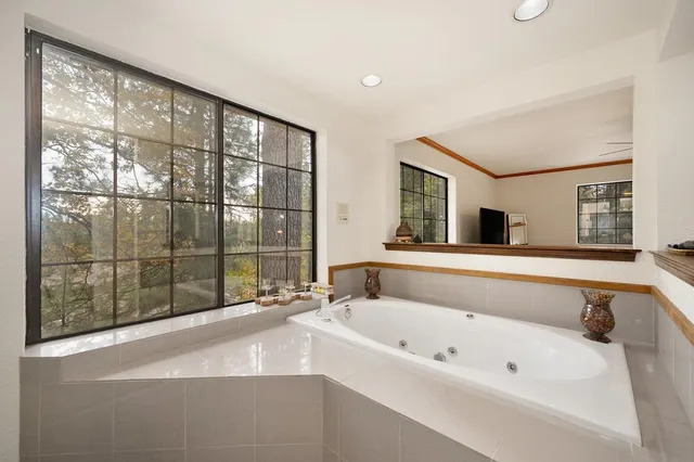 a view of balcony with furniture and umbrella