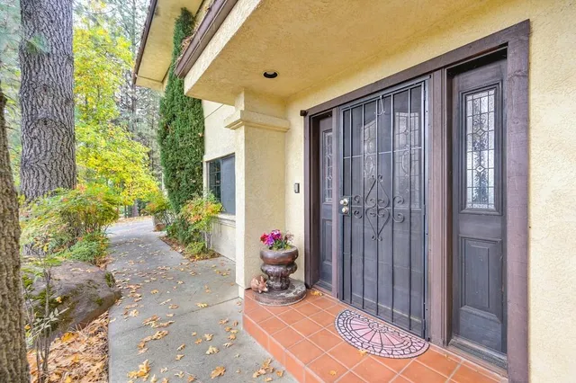 a living room with furniture and large windows