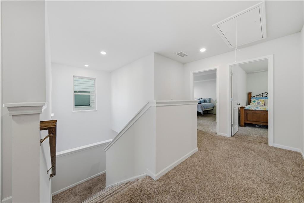 4000 Lake Manor Way Atlanta, GA 30349 - Photo 19 of 36 a view of a livingroom with furniture and a hallway