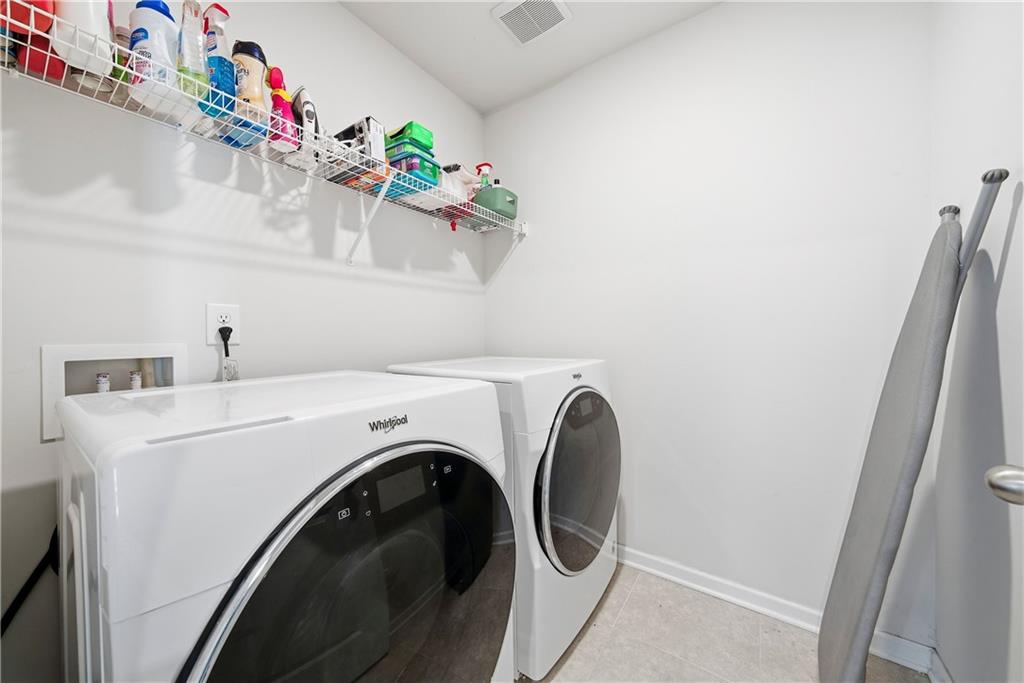4000 Lake Manor Way Atlanta, GA 30349 - Photo 30 of 36 a view of washer and dryer in a kitchen