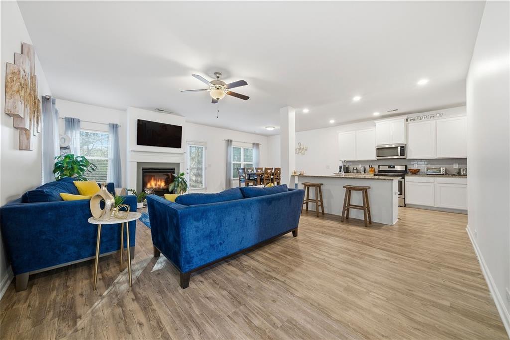 4000 Lake Manor Way Atlanta, GA 30349 - Photo 3 of 36 a living room with furniture and a fireplace