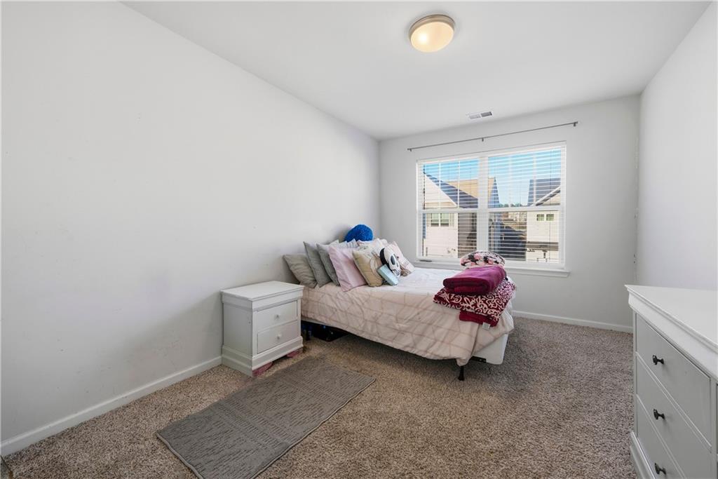 4000 Lake Manor Way Atlanta, GA 30349 - Photo 31 of 36 a living room with furniture and a window