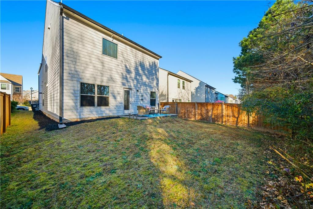 4000 Lake Manor Way Atlanta, GA 30349 - Photo 34 of 36 a view of an house with backyard and garden