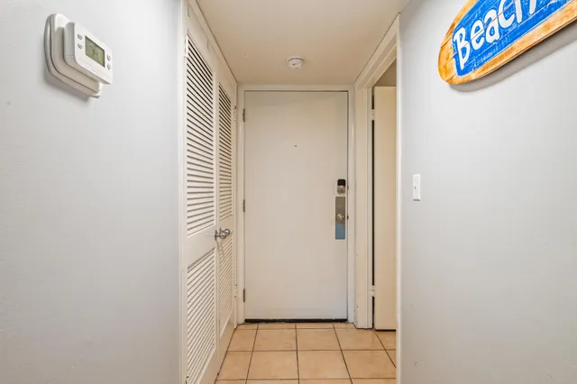 a bedroom with a bed and a lamp