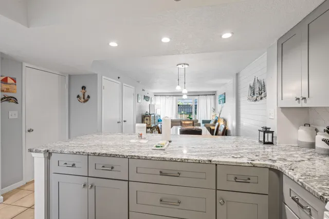 a kitchen with sink stove and cabinets