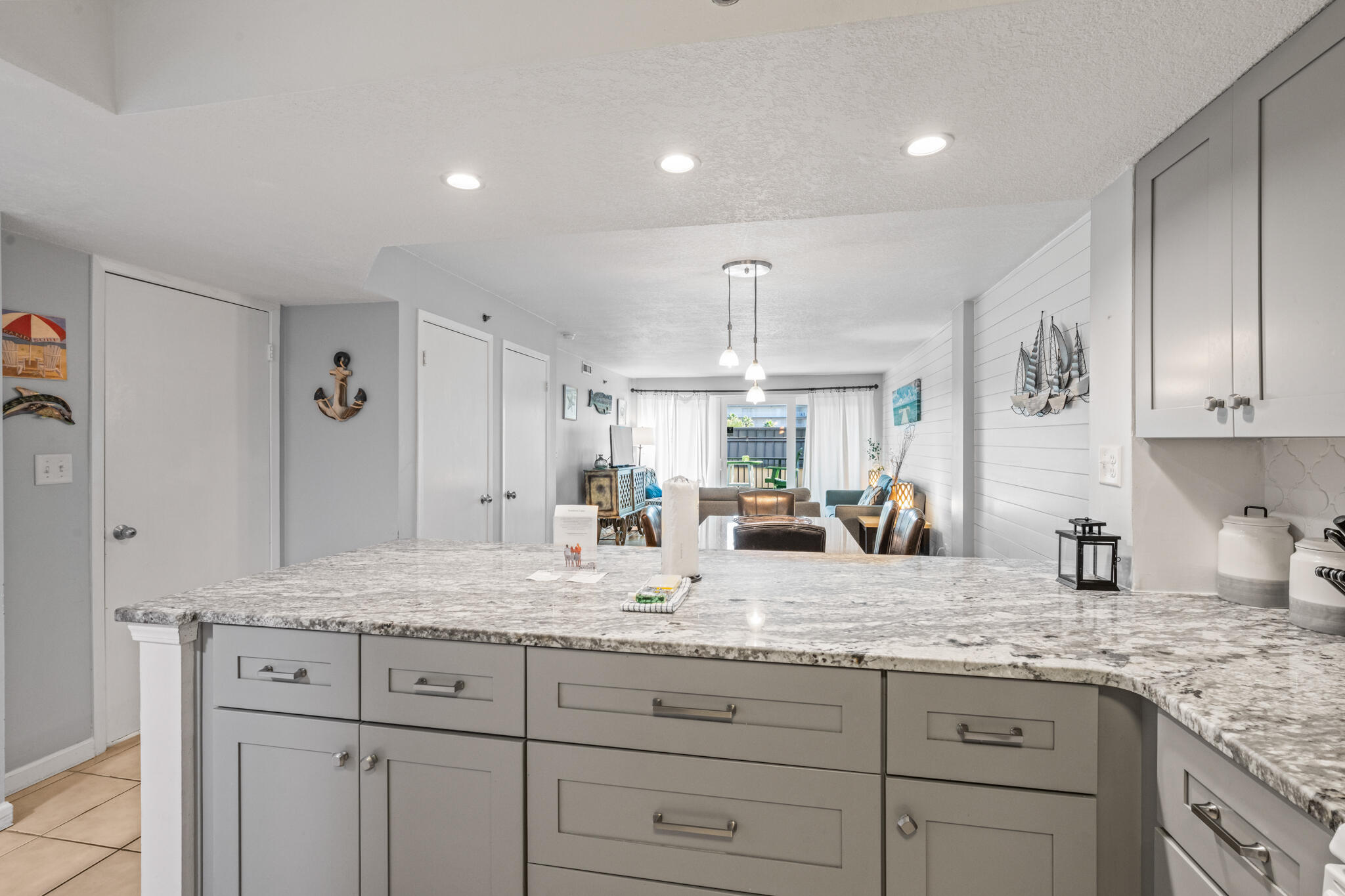 1114 Santa Rosa Boulevard, Unit 309 Fort Walton Beach, FL 32548 - Photo 23 of 52 a bathroom with a granite countertop double sink and a mirror
