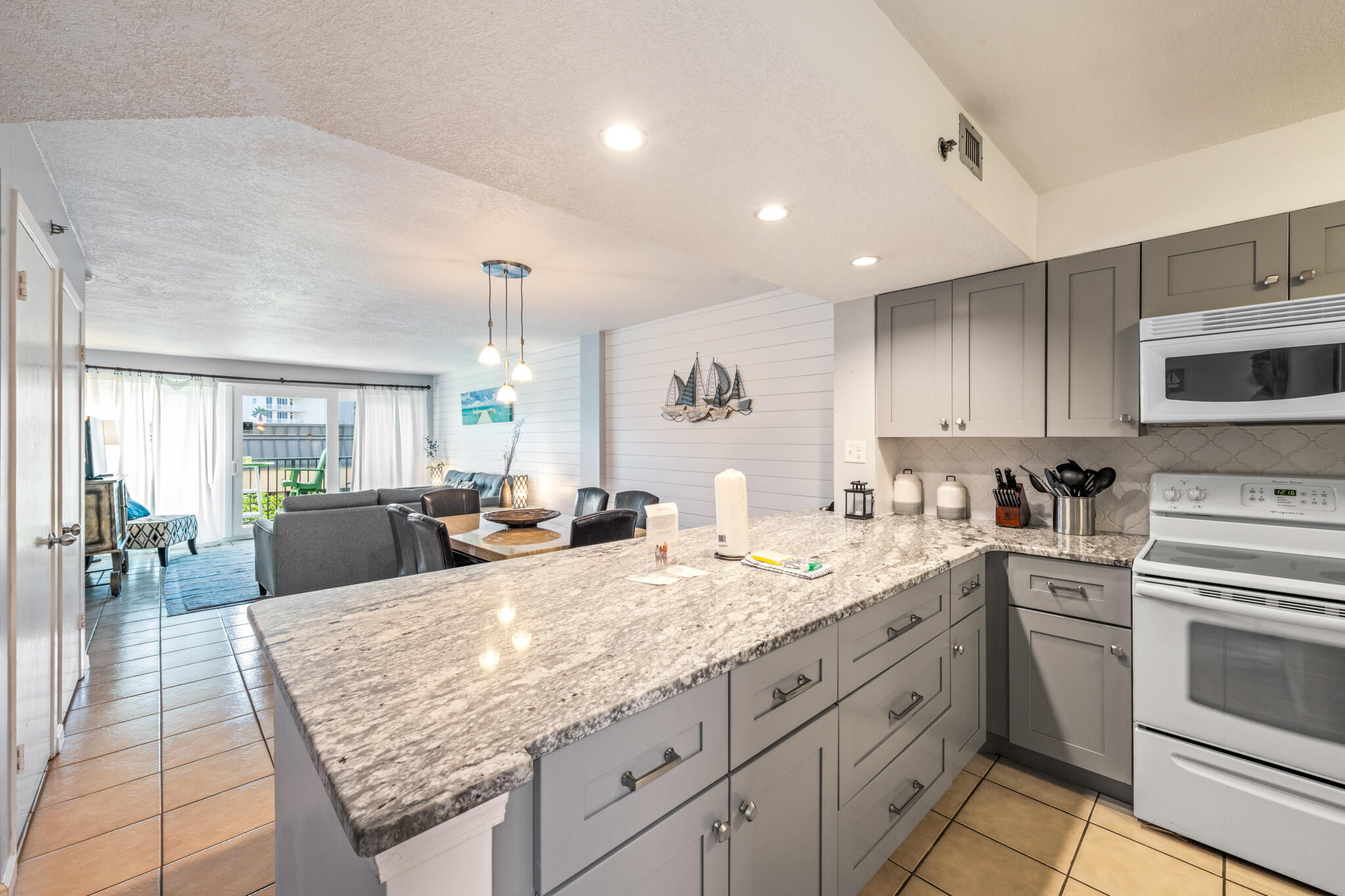 1114 Santa Rosa Boulevard, Unit 309 Fort Walton Beach, FL 32548 - Photo 24 of 52 a kitchen with sink stove and cabinets