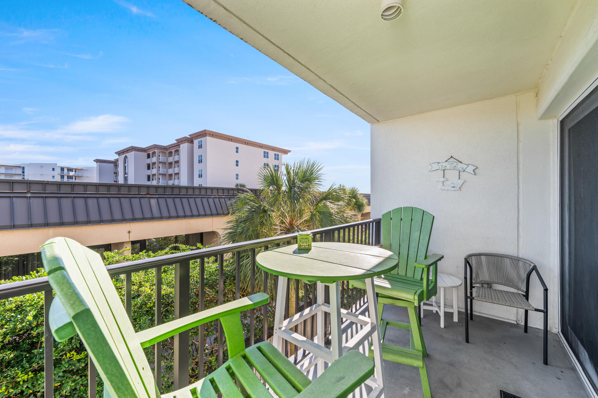 1114 Santa Rosa Boulevard, Unit 309 Fort Walton Beach, FL 32548 - Photo 30 of 52 a view of a chairs and table in patio
