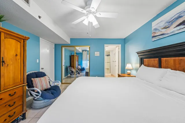 a bathroom with a granite countertop sink a shower and a mirror
