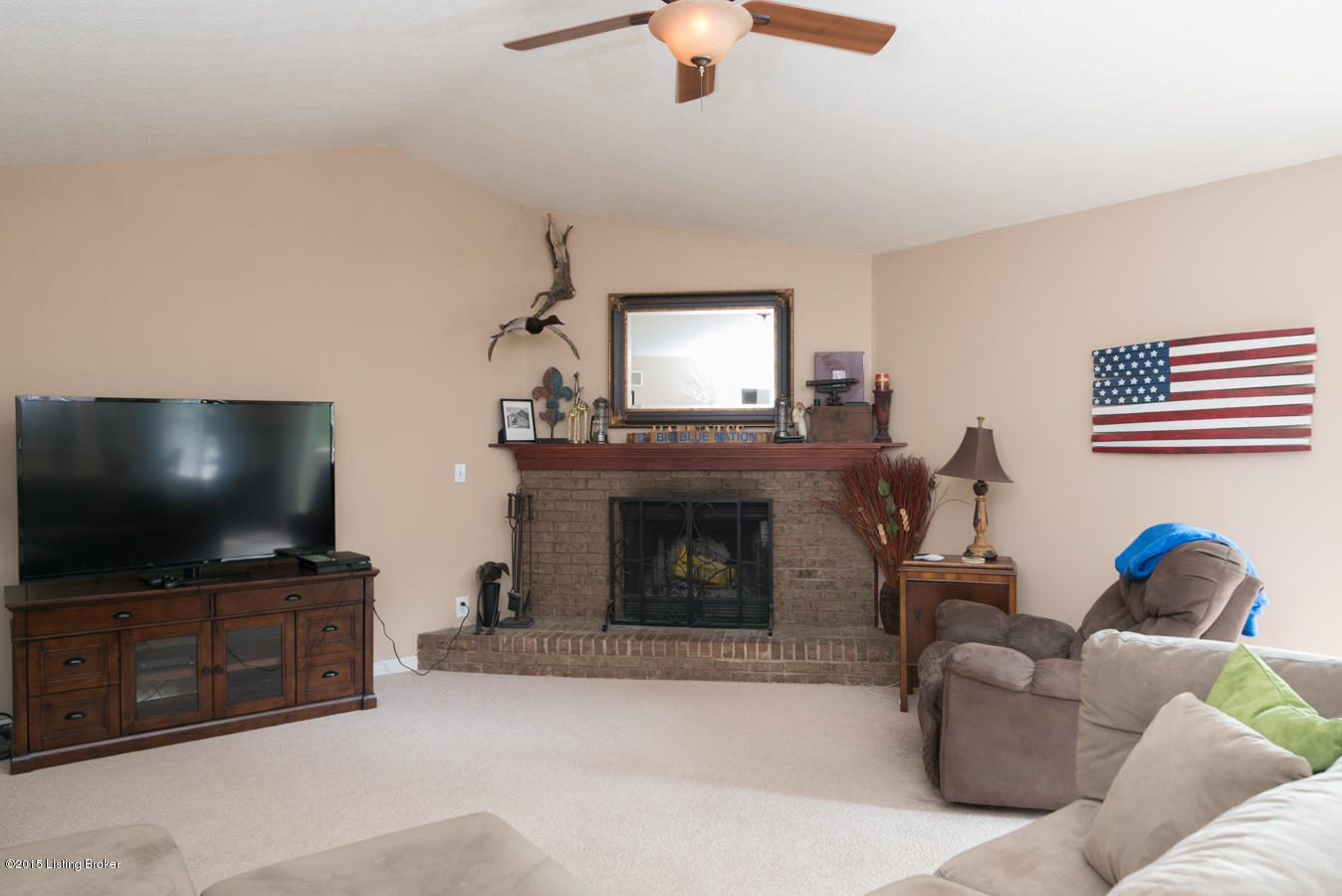 3072 University Road Louisville, KY 40206 - Photo 10 of 45 Living room with vaulted ceiling and fireplace