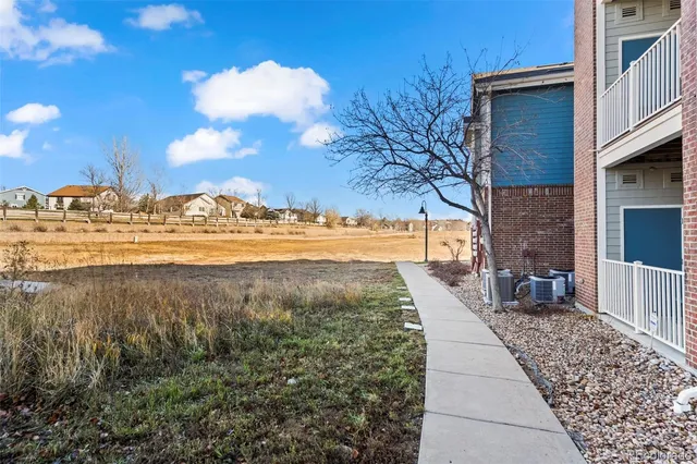 a view of a yard with an ocean view