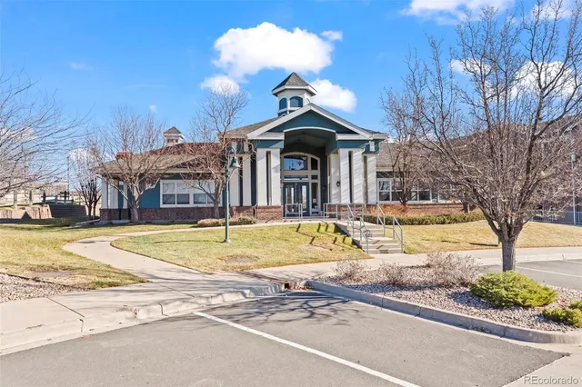 a view of a house with swimming pool and a yard