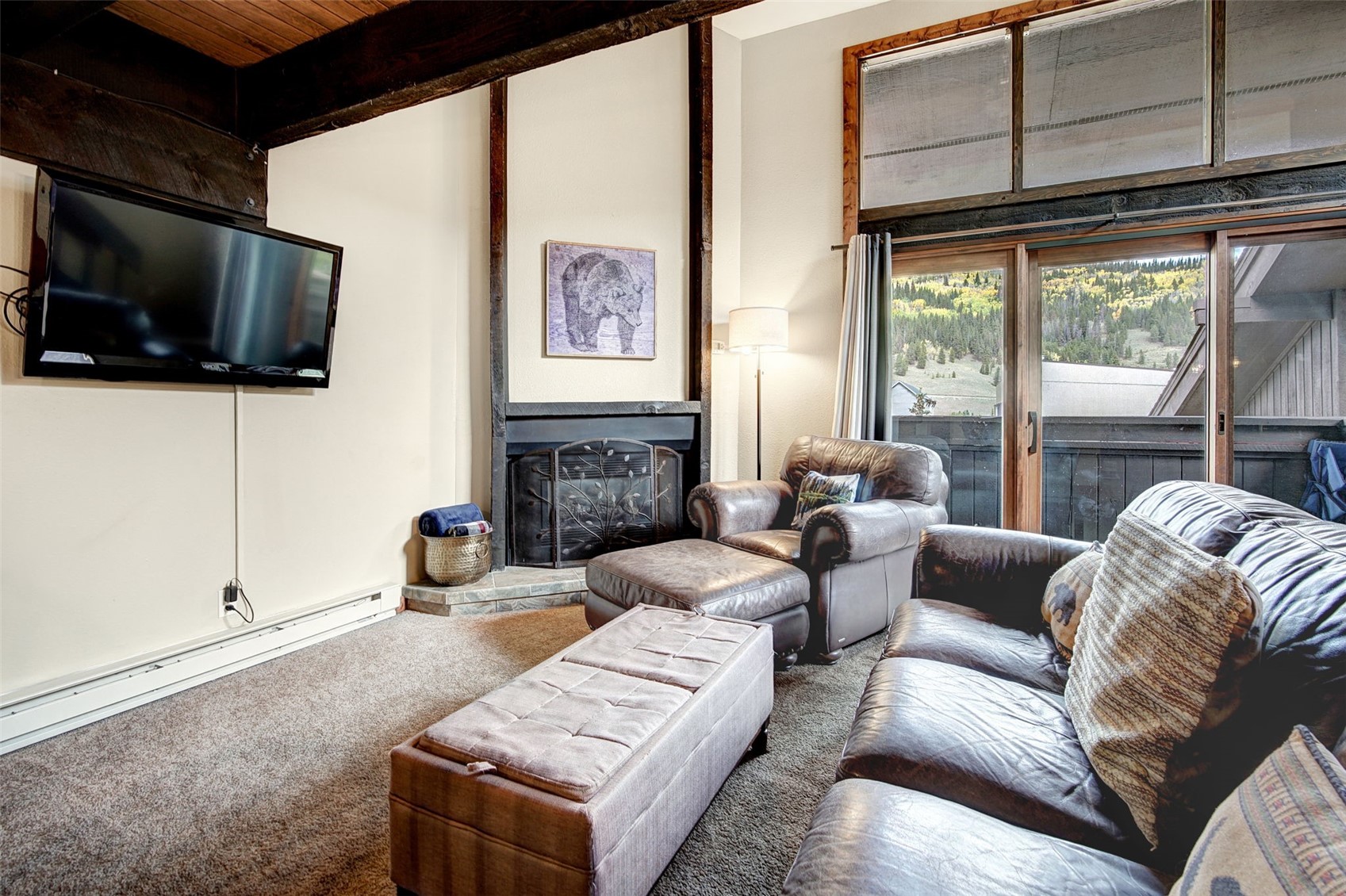 78 Guller Road, Unit 301 Copper Mountain, CO 80443 - Photo 2 of 41 With vaulted ceilings and ample seating, the living room is the perfect place to gather.