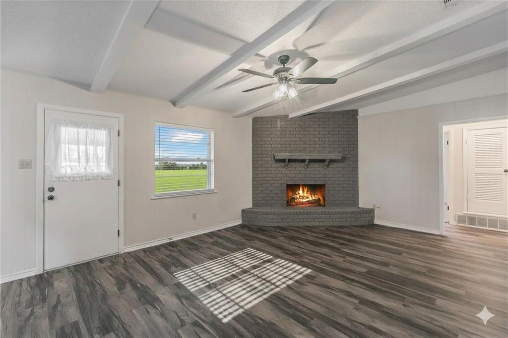 6248 Trail Lake Drive Fort Worth, TX 76133 - Photo 12 of 28 an empty room with windows fireplace and a sink