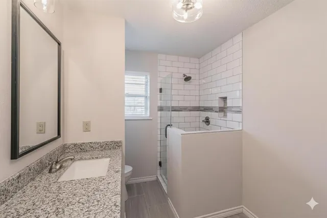 a room with a sink and a washer dryer