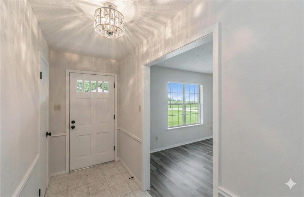 6248 Trail Lake Drive Fort Worth, TX 76133 - Photo 2 of 28 wooden floor in an empty room with a window