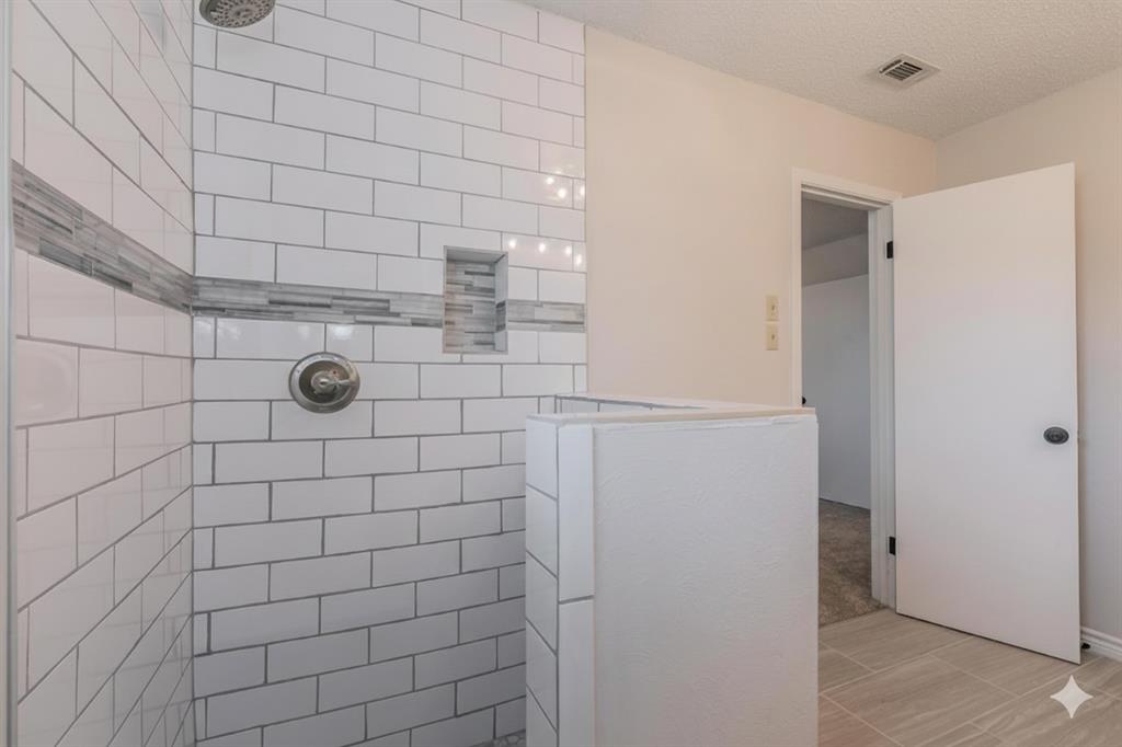 6248 Trail Lake Drive Fort Worth, TX 76133 - Photo 21 of 28 a bathroom with a shower