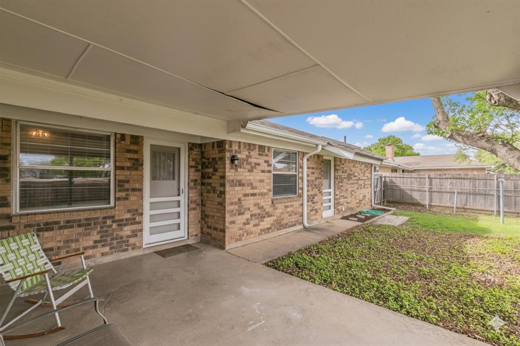 6248 Trail Lake Drive Fort Worth, TX 76133 - Photo 23 of 28 a view of a porch with furniture and a yard