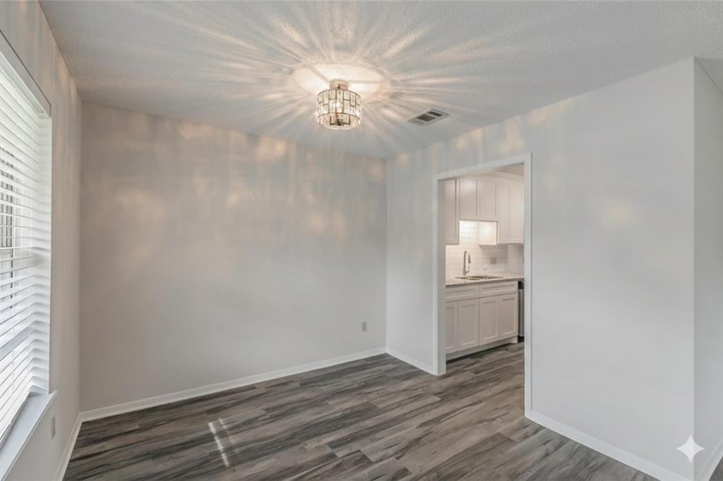 6248 Trail Lake Drive Fort Worth, TX 76133 - Photo 6 of 28 a view of a livingroom with wooden floor