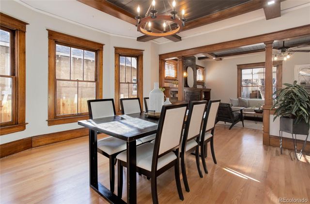 a view of a dining room with furniture window and wooden floor