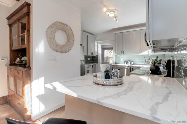 a kitchen with a table and chairs in it
