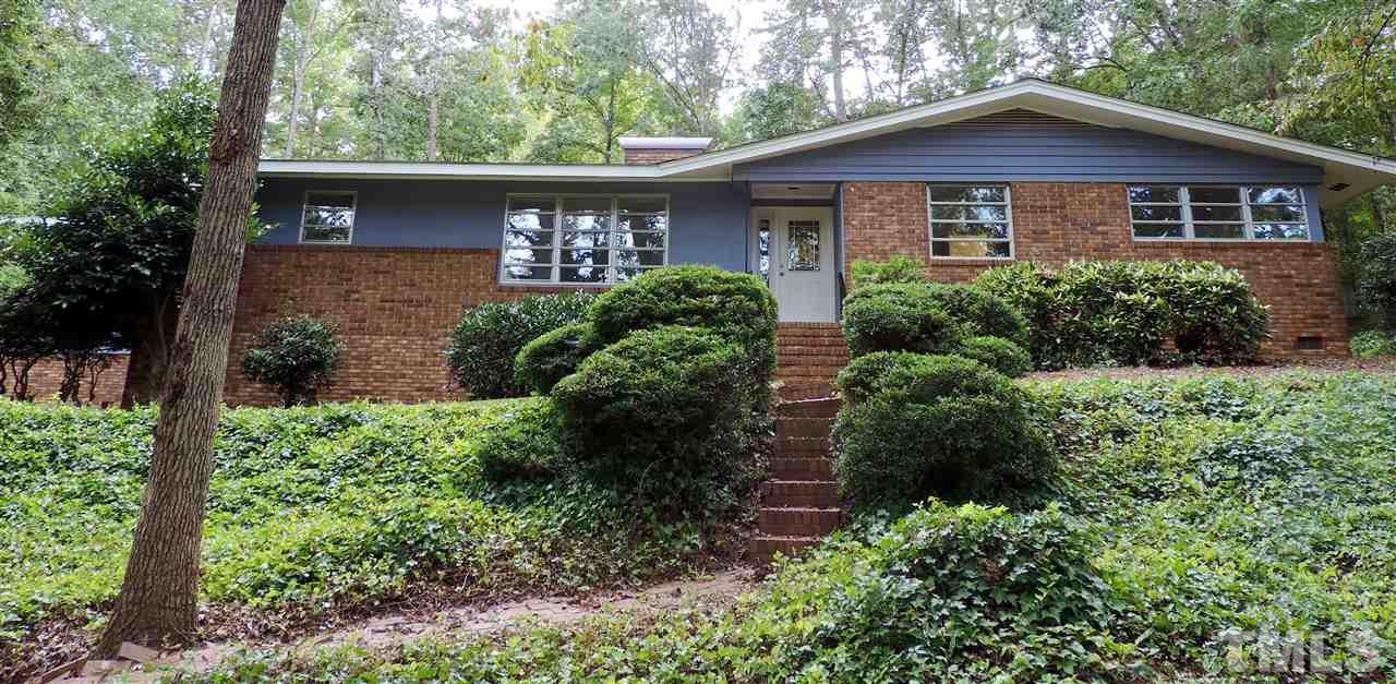 1303 Lorimer Road Raleigh, NC 27606 - Photo 1 of 13 front view of a house with a yard