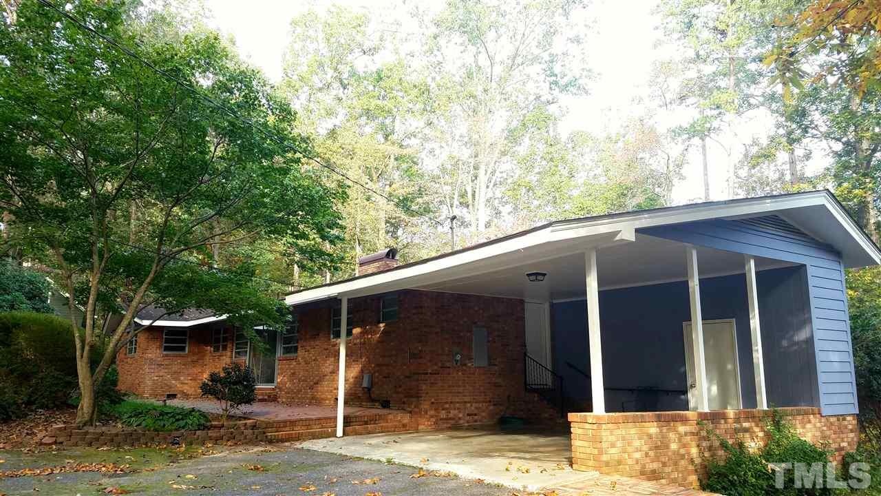 1303 Lorimer Road Raleigh, NC 27606 - Photo 2 of 13 a front view of a house with garden