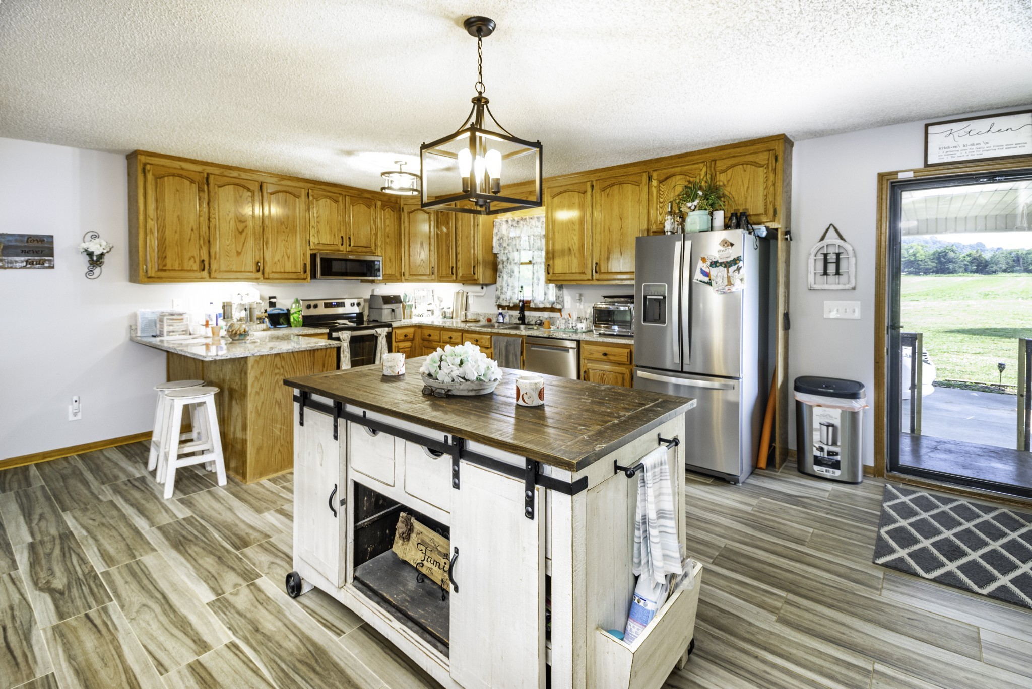 2285 Crescentview Road Pulaski, TN 38478 - Photo 4 of 31 a kitchen with a stove and a refrigerator