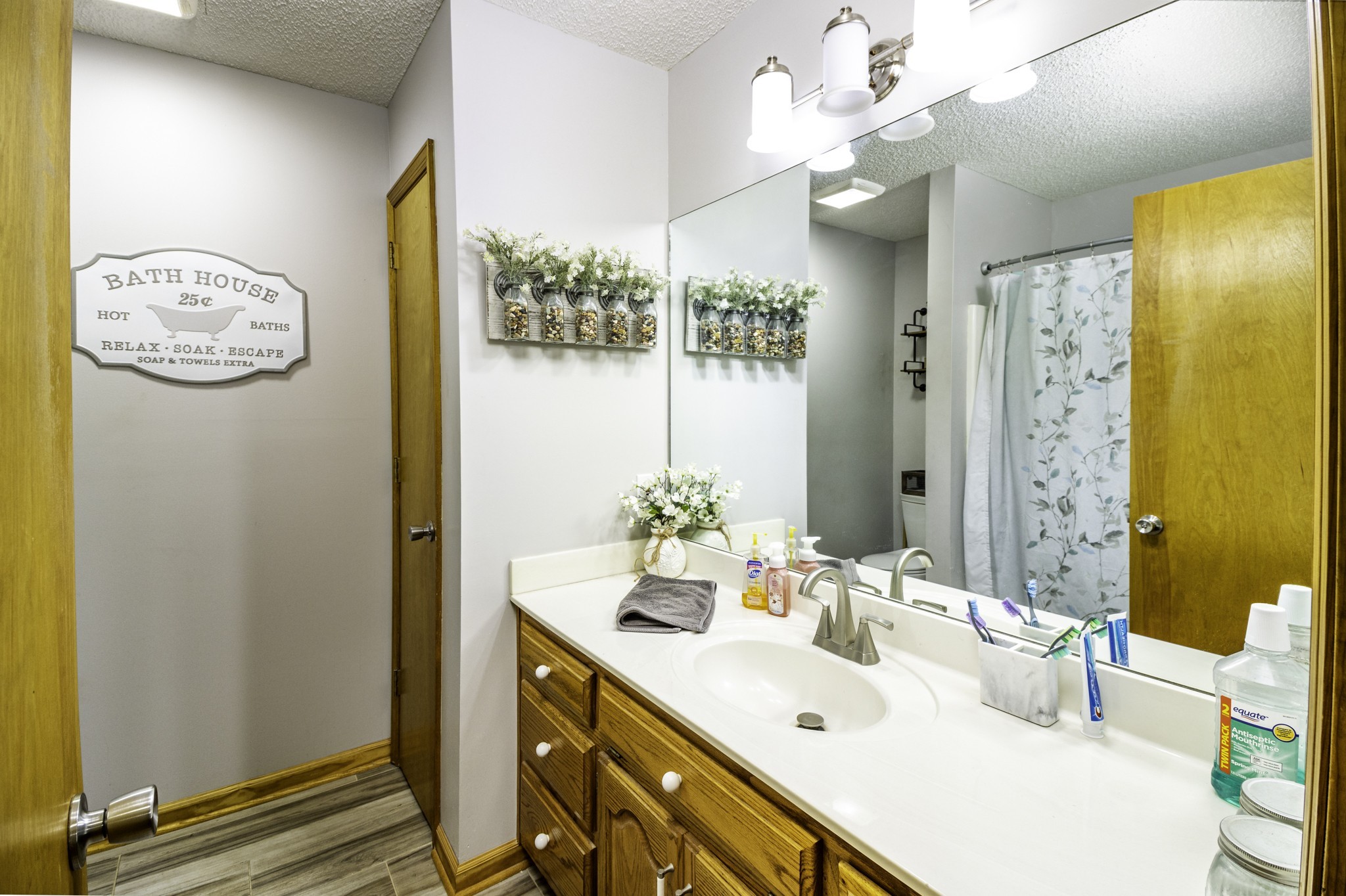 2285 Crescentview Road Pulaski, TN 38478 - Photo 10 of 31 a bathroom with a sink mirror and a shower