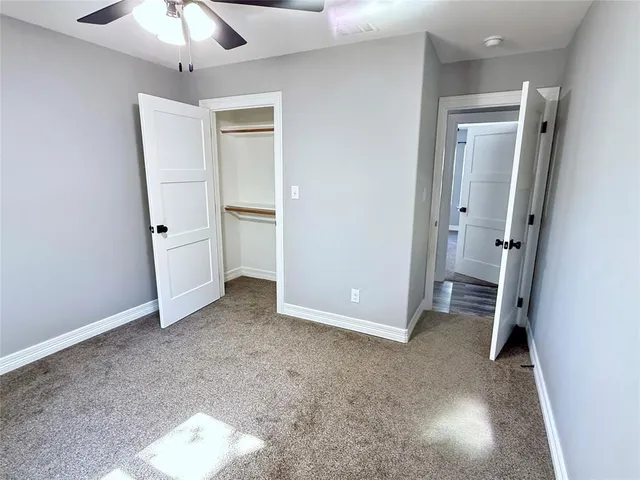 a bathroom with a toilet a sink and a shower