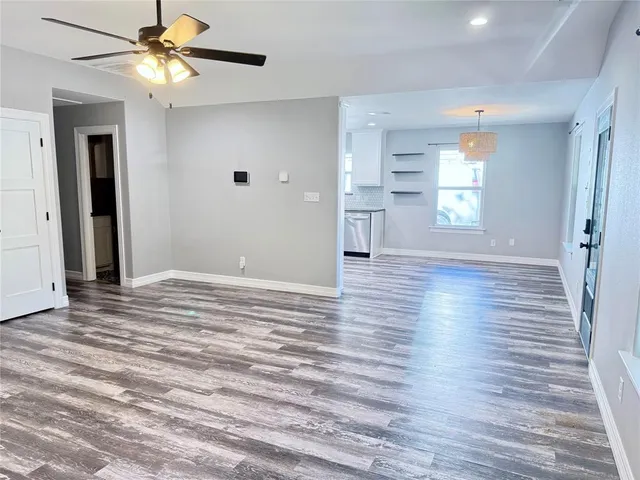 a kitchen with stainless steel appliances a stove sink and microwave