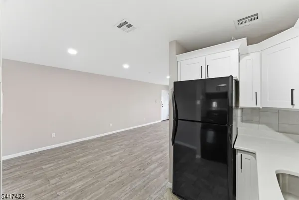 a refrigerator freezer sitting in a kitchen