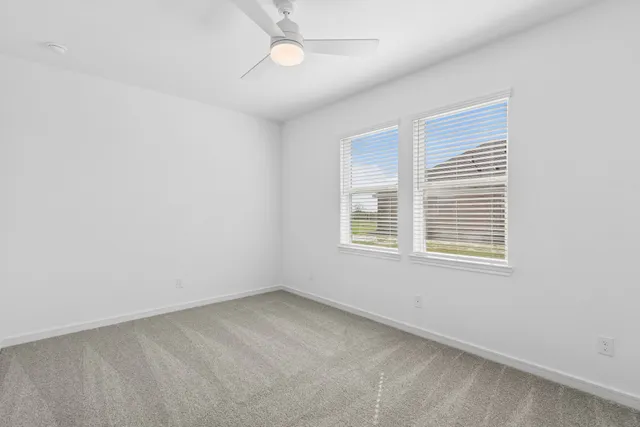 a bathroom with double vanity sink a mirror and a bathtub