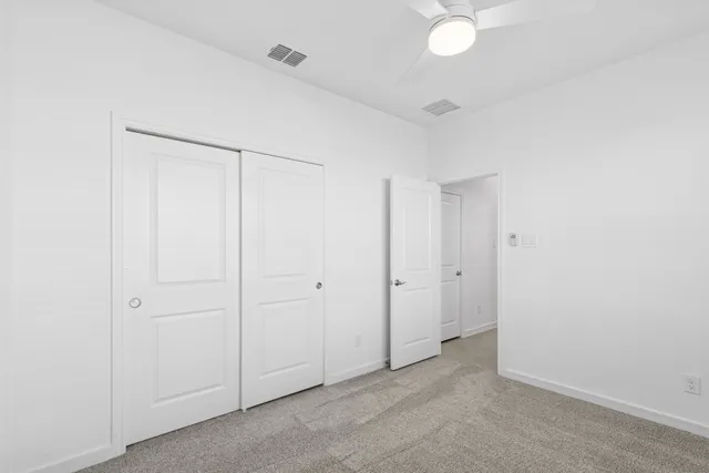 a living room with fireplace furniture and a wooden floor