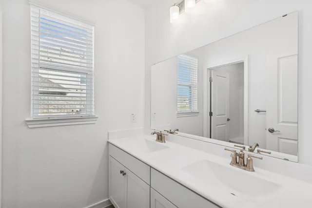 a kitchen with stainless steel appliances kitchen island granite countertop a dining table and chairs