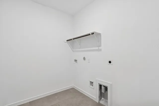 a living room with fireplace kitchen island furniture and a chandelier
